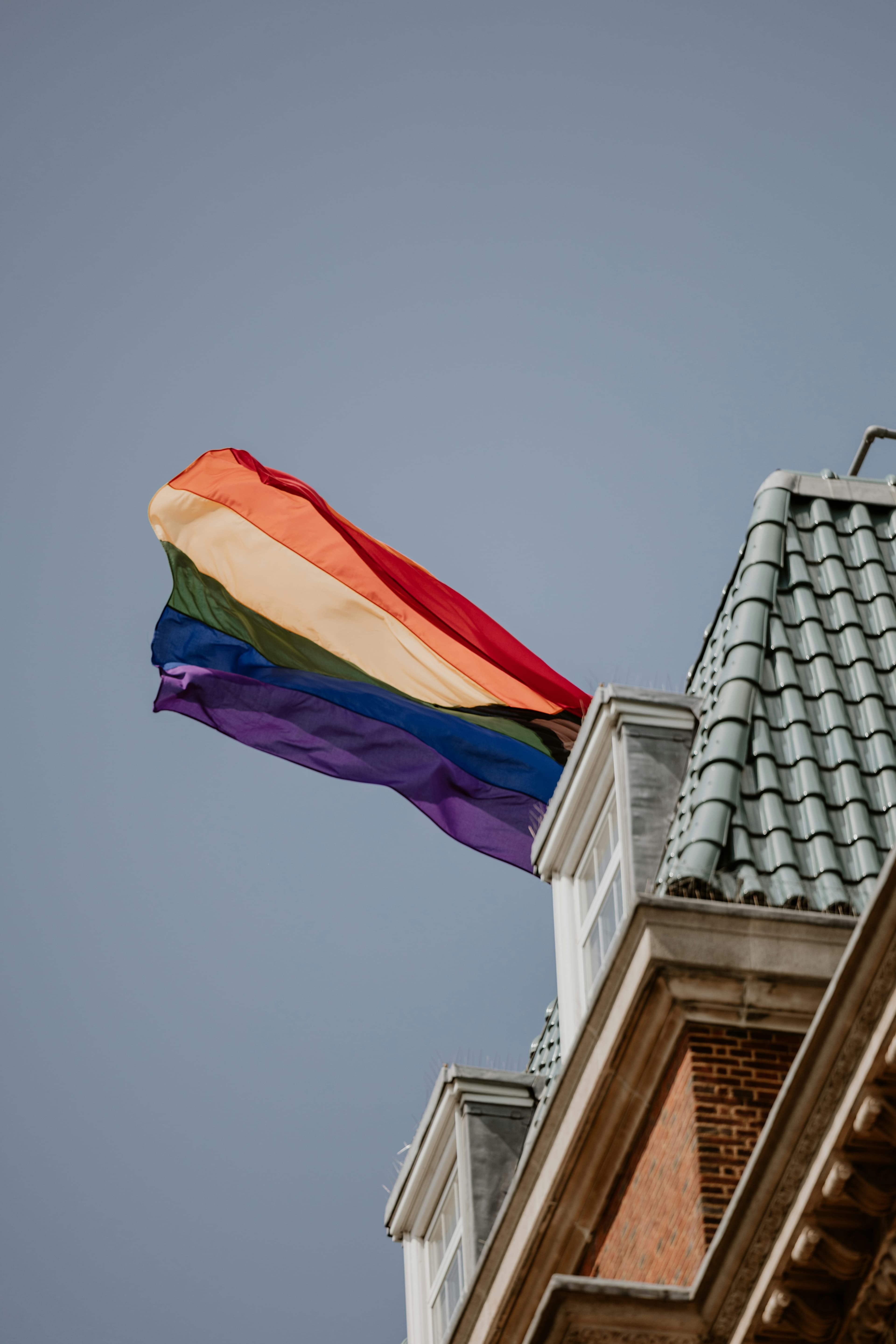 Rainbow flag flying proudly in the city — safe, inclusive travel